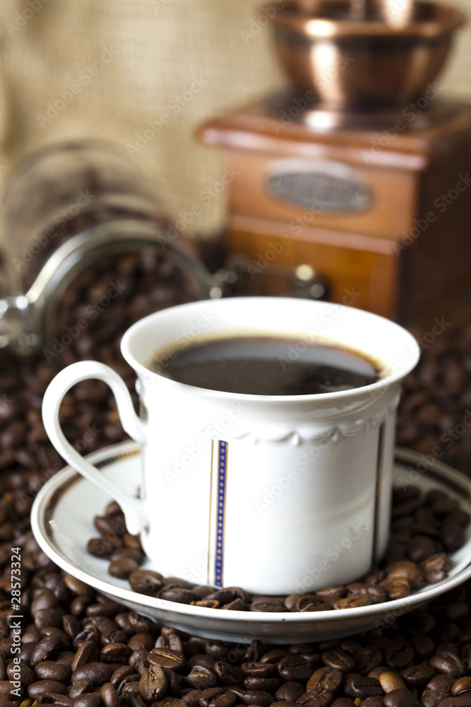 Coffee over dark roasted coffee beans Coffee over dark roasted coffee beans