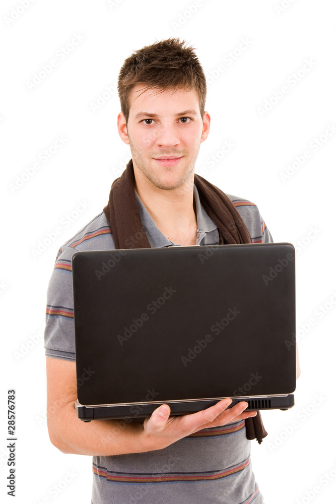 Young casual man standing with a laptop computer. Isolated on wh Young casual man standing with a laptop computer. Isolated on wh