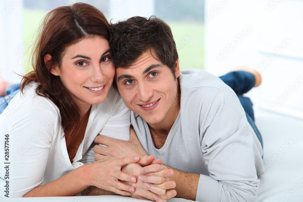 Young couple laying on sofa Young couple laying on sofa