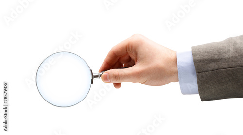 Magnifying glass in hand isolated over white background
