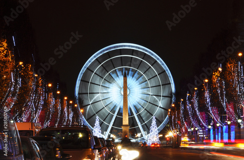 The ferris wheel on Concorde square seen from the Champs-Elysées photo