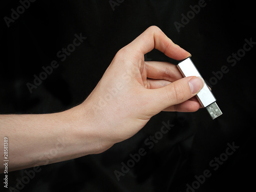 Hand with USB fash drive