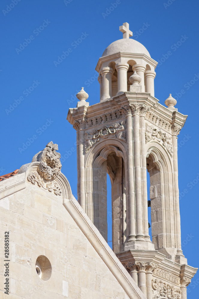 High church bell tower opposite blue sky