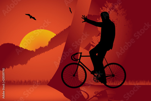 Young man riding a fixed-gear bicycle also called fixie