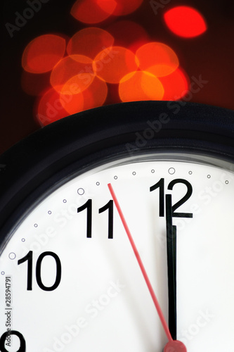 Office clock about to show midnight - few seconds to New Year