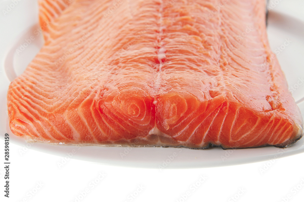 big salmon fillet on white plate big salmon fillet on white plate