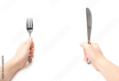 Hands holding knife and fork