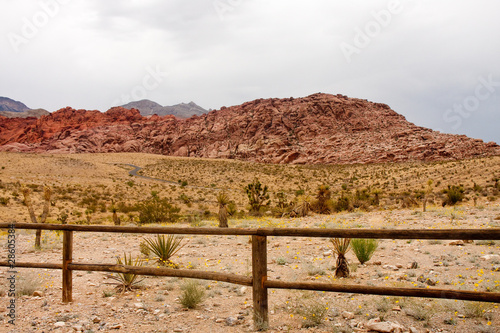 Wood Rail Fence Across Desert by Mountains