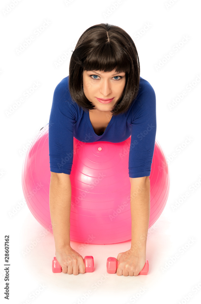 Fototapeta premium Exercises with dumbbells on a gymnastic ball