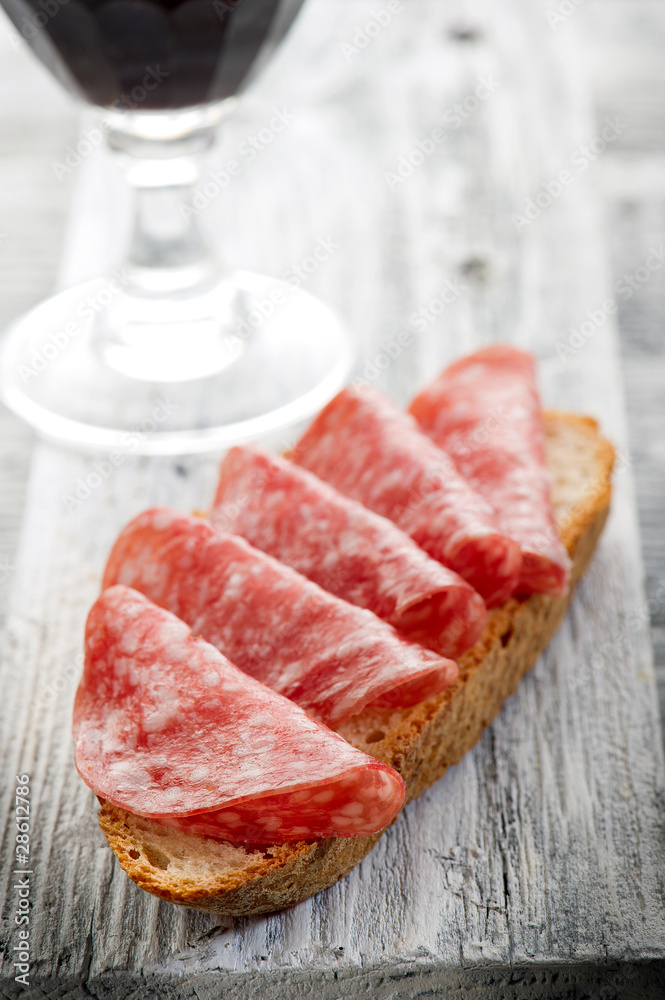 slice bread with salami and wine -pane salame e vino slice bread with salami and wine -pane salame e vino