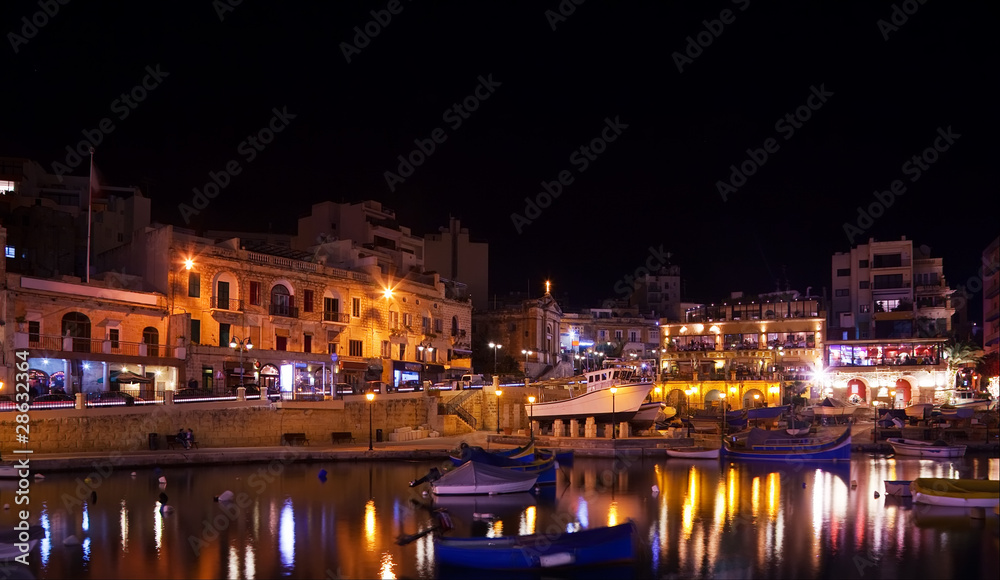 Boats at  St. Julian's bay in night