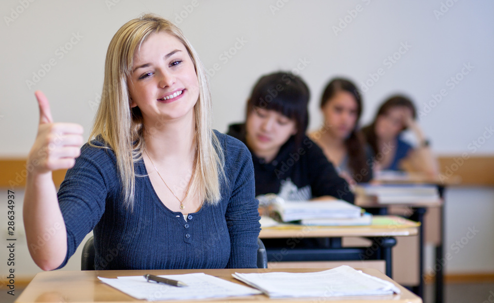 Happy Student has fun while working in classroom Happy Student has fun while working in classroom