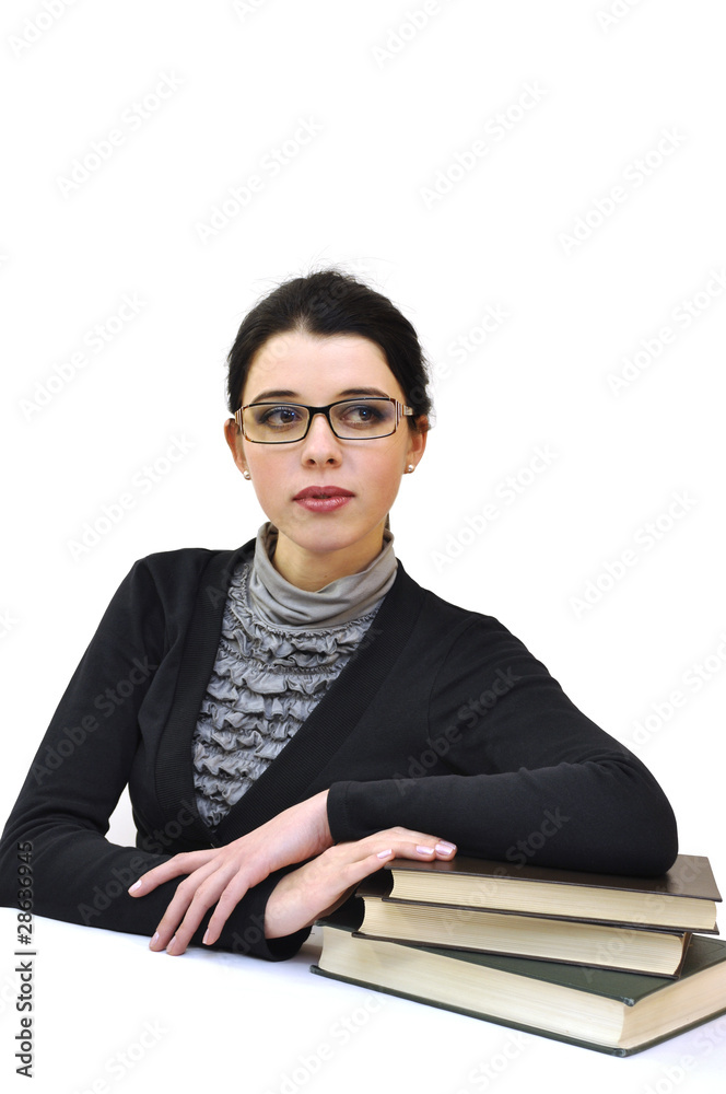 Young beautiful woman in glasses leaning on the books Young beautiful woman in glasses leaning on the books