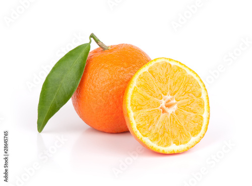 fresh mandarin fruits with cut and green leaves