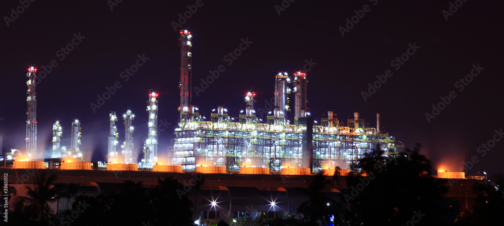 panoramic view of oil refinery factory at night