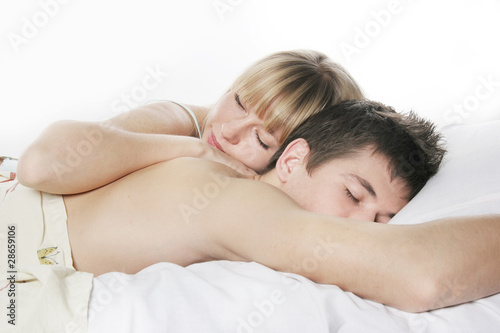 sleeping couple in bed