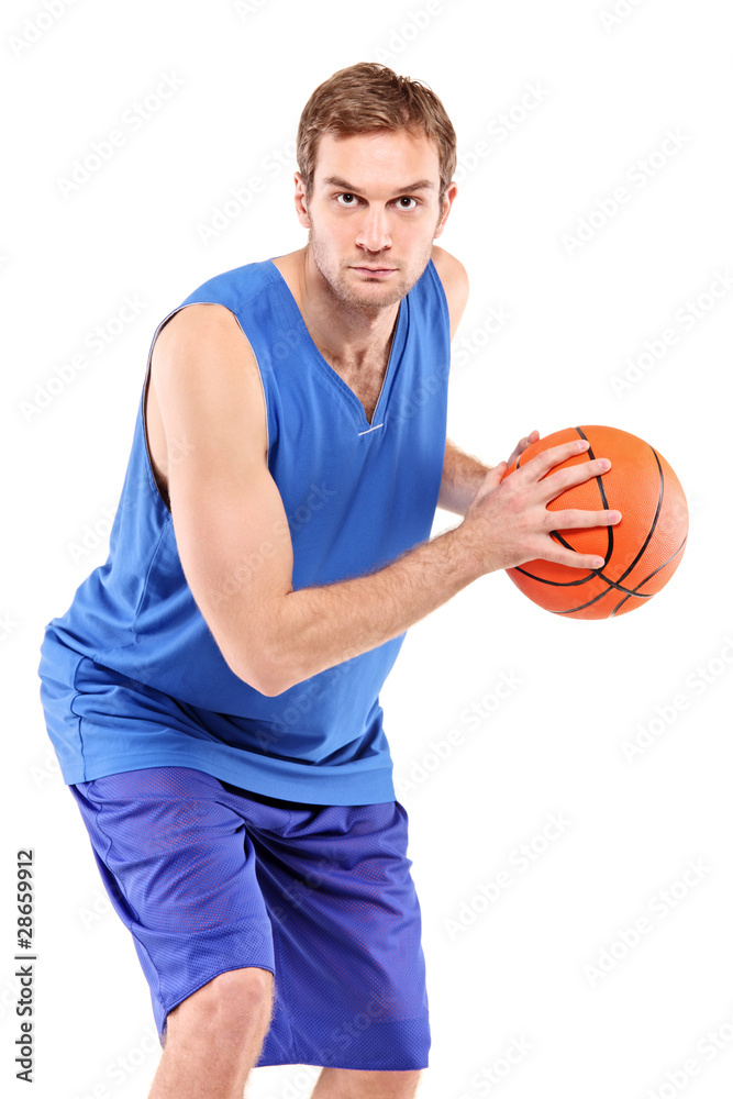 Basketball player posing with a ball