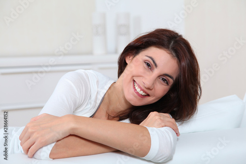 Portrait of young woman relaxing in sofa