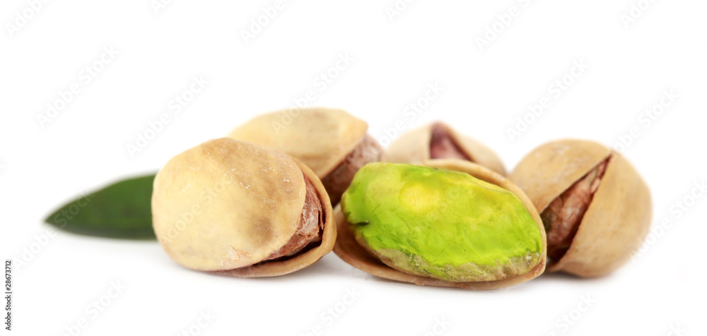 Pistachios macro with green leaf Pistachios macro with green leaf