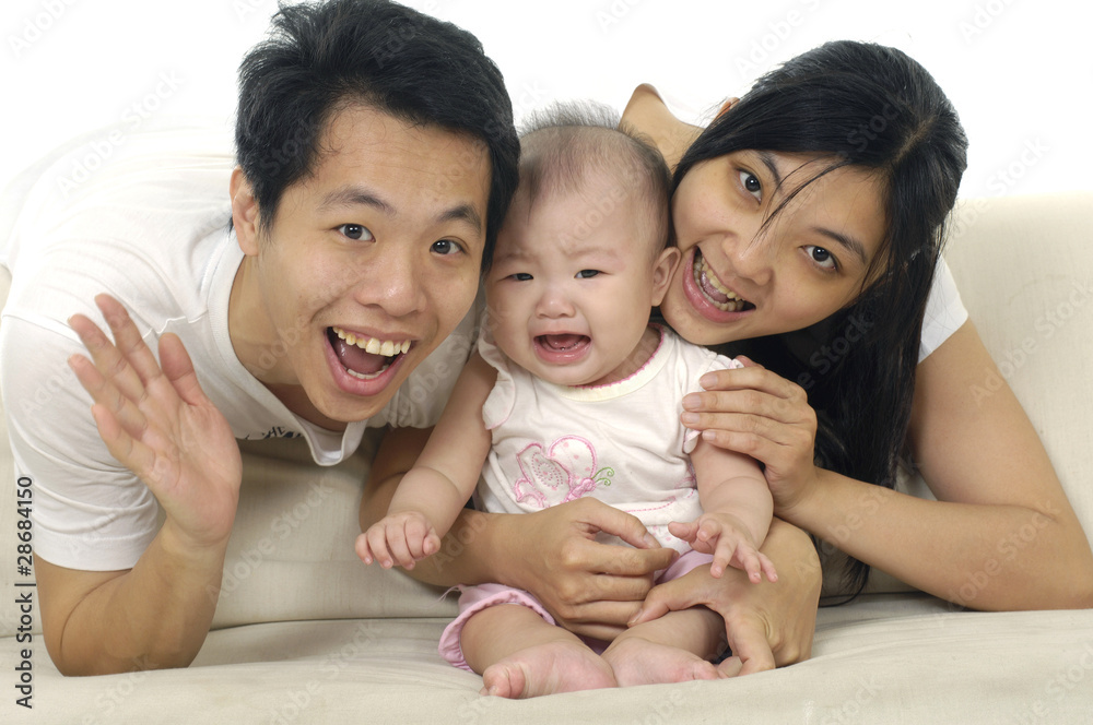 Happy Family enjoying baby together isolated Happy Family enjoying baby together isolated