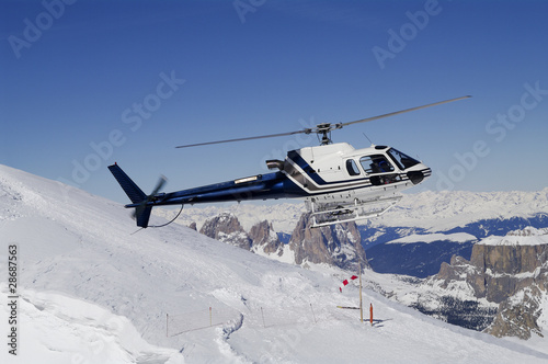 Helicopter landing in ski region photo