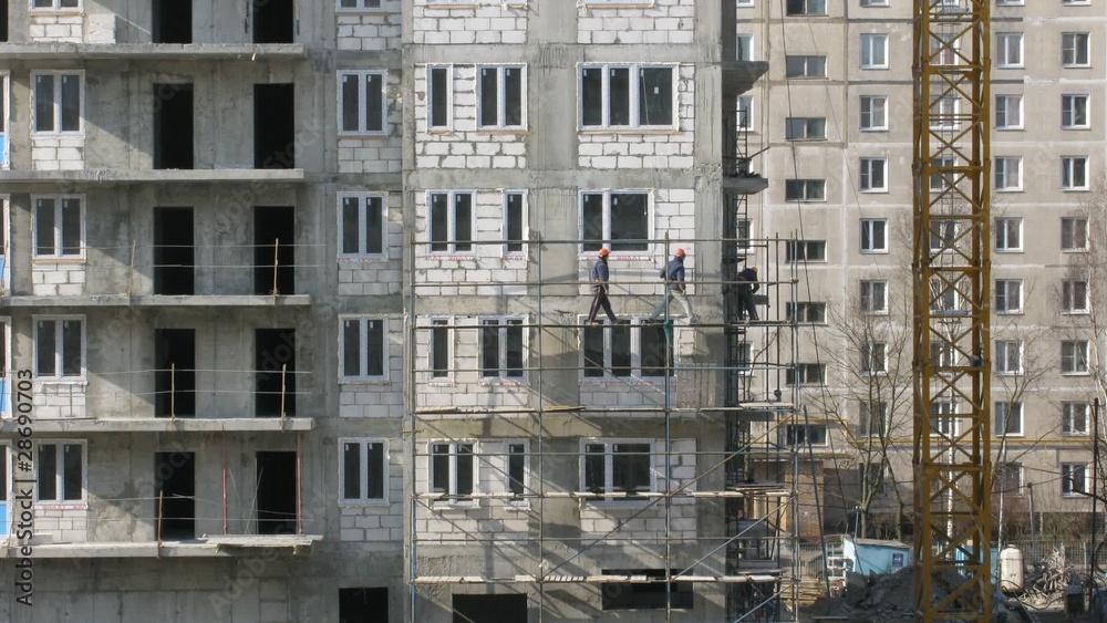 House building, builders build scaffolding House building, builders build scaffolding