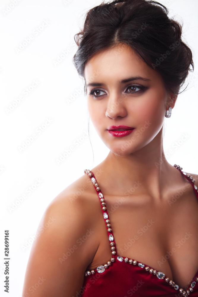 Portrait of a cute brunette sizzling look on a white background