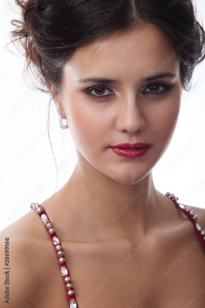 Portrait of a cute brunette sizzling look on a white background