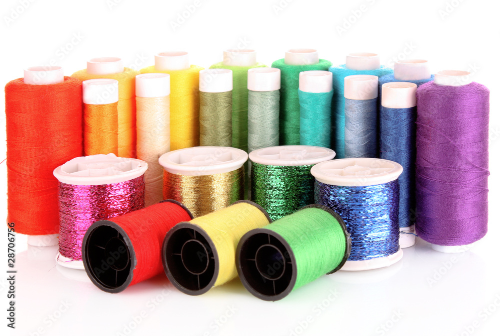 Semicircle of many-coloured bobbins of thread isolated on white Semicircle of many-coloured bobbins of thread isolated on white