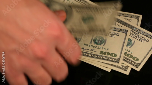 Man's hands counting dollars