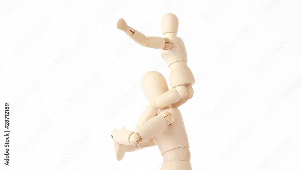 rotating wooden figures of child sits on neck of man rotating wooden figures of child sits on neck of man