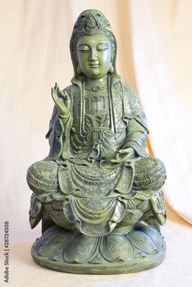Fototapeta premium Bronze figure of sitting and meditating Buddha