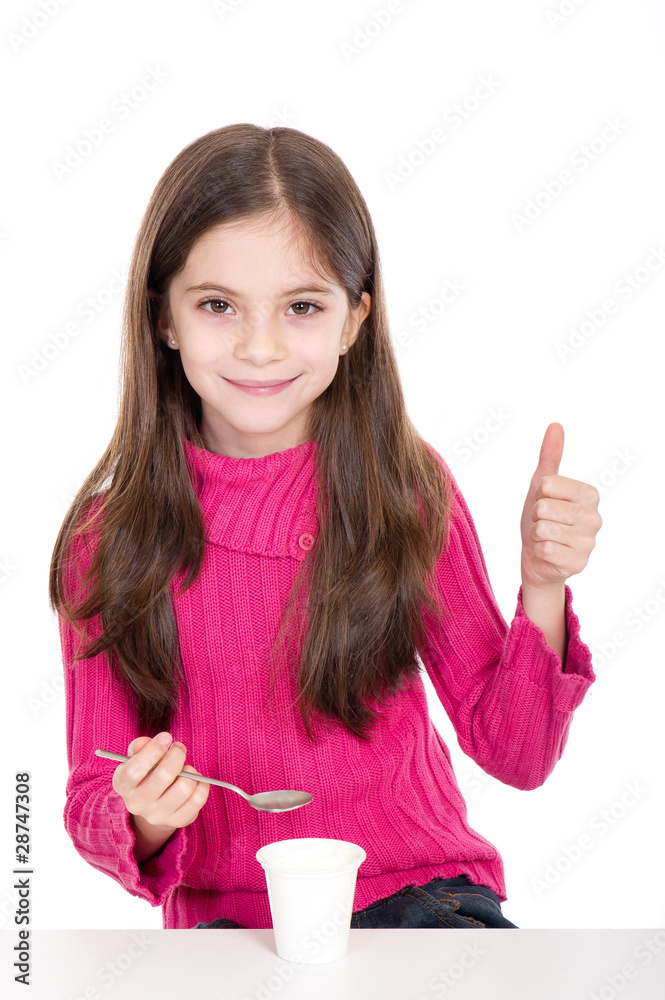 little girl eating yoghurt thumb up-bambina mangia yogurt little girl eating yoghurt thumb up-bambina mangia yogurt