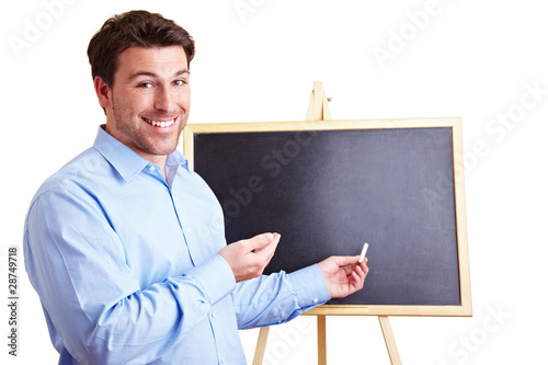 Lachender Lehrer vor Tafel photo