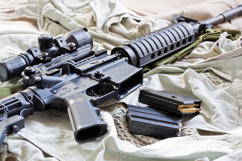 Close-up of AR-15 rifle and magazines with ammo