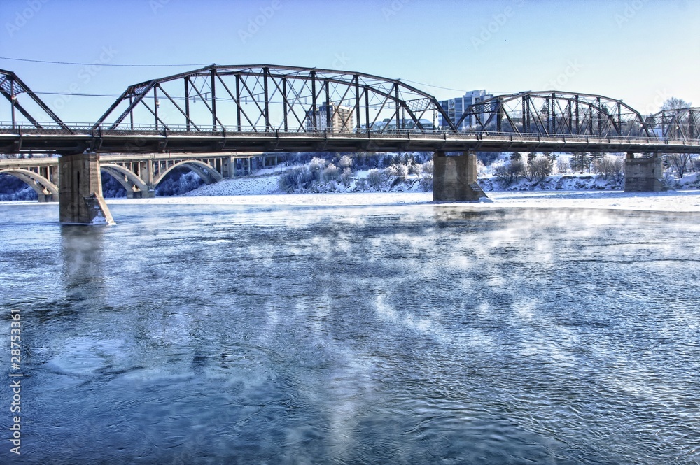Obraz premium Bridge over the Icy River