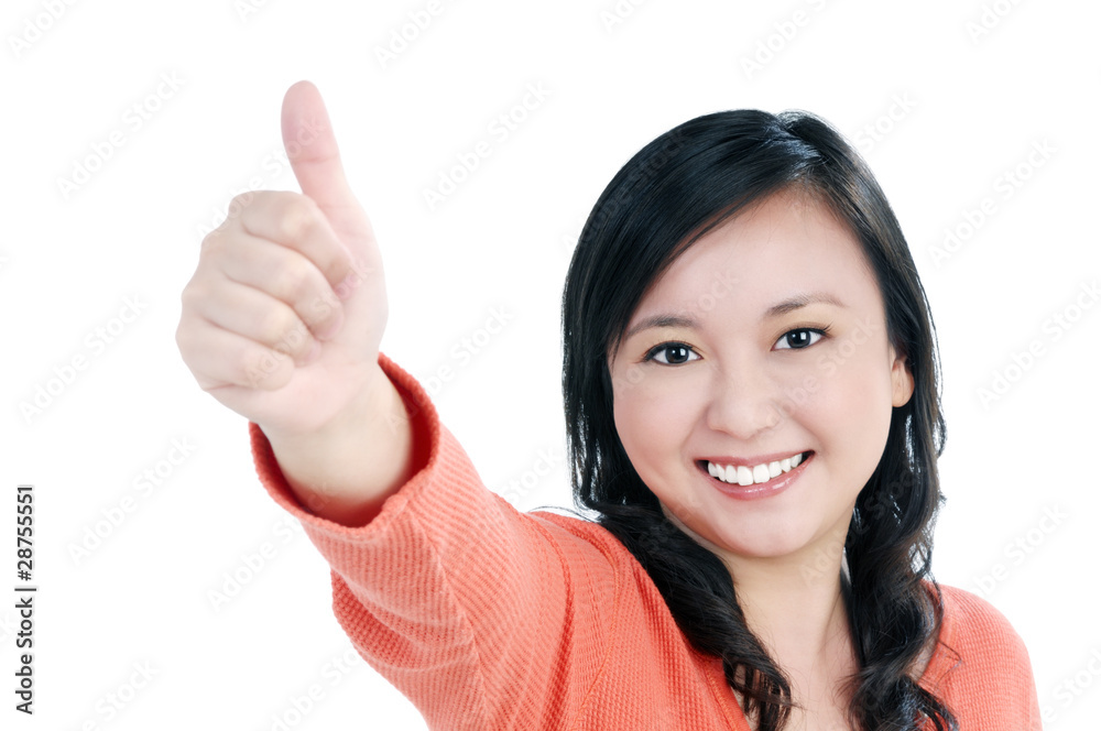 Smiling woman giving thumb up sign Smiling woman giving thumb up sign
