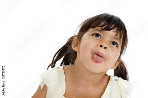 beautiful little girl sticking her tongue out