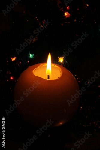 burning candle during Christmastime