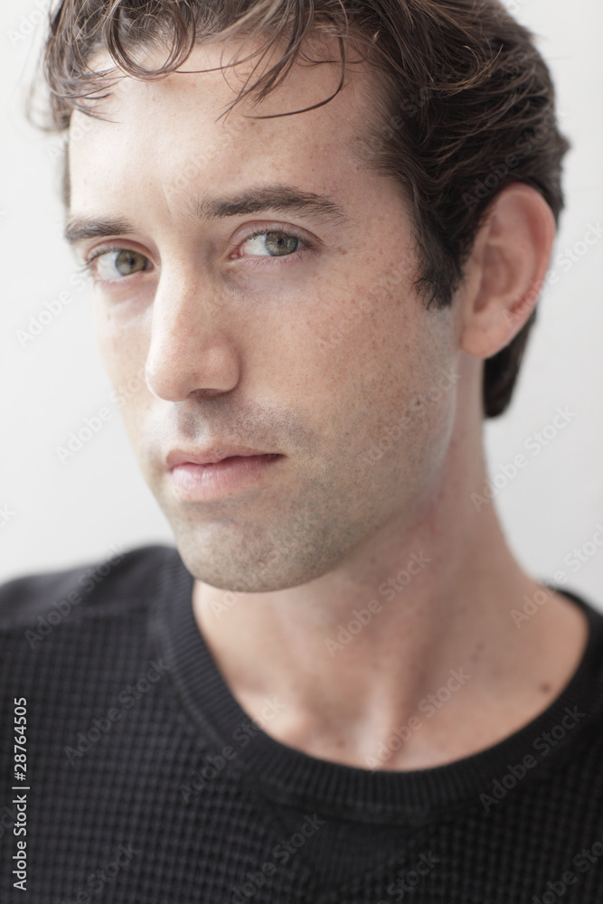 Headshot of a handsome man in a black shirt Headshot of a handsome man in a black shirt