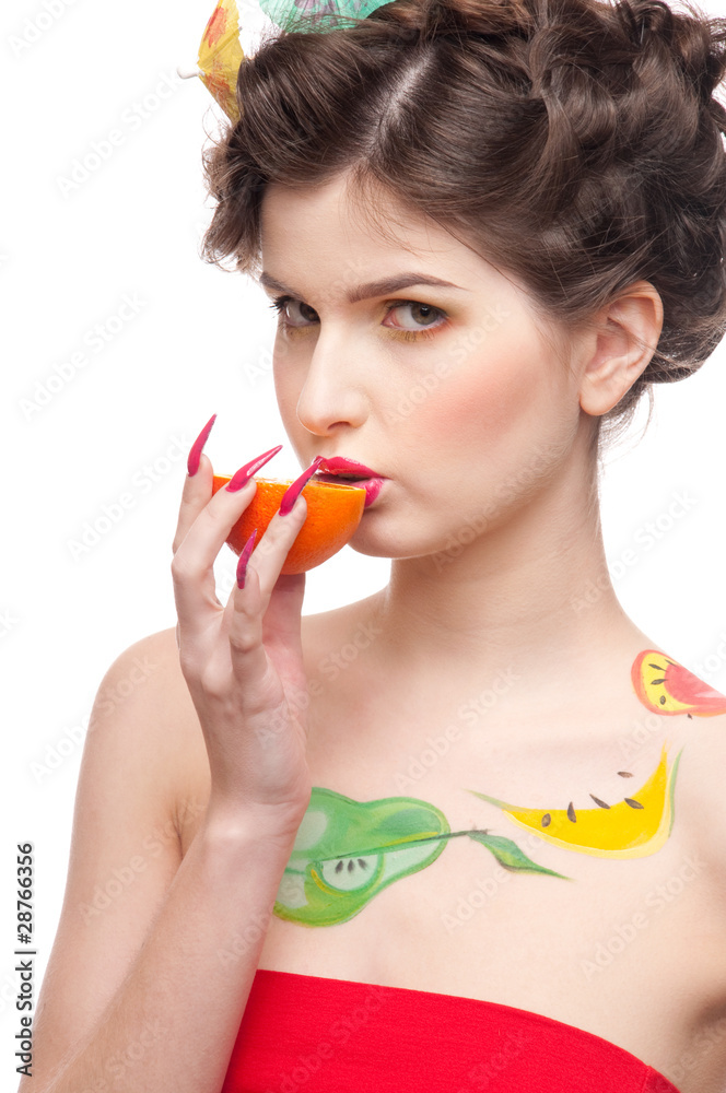 Close up portrait of beauty woman with fruit bodyart and orange Close up portrait of beauty woman with fruit bodyart and orange