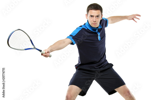 A male squash player playing