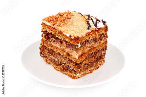 Wallpaper Mural Slice of nut cream cake, isolated on white background Torontodigital.ca