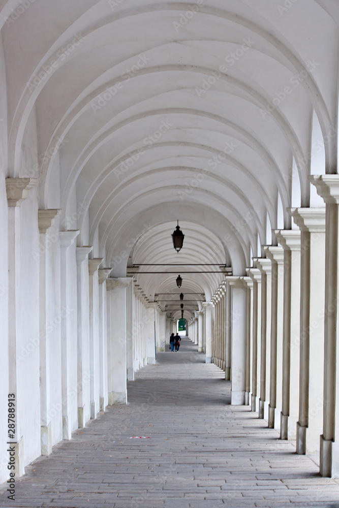 White colonnade with two lovers