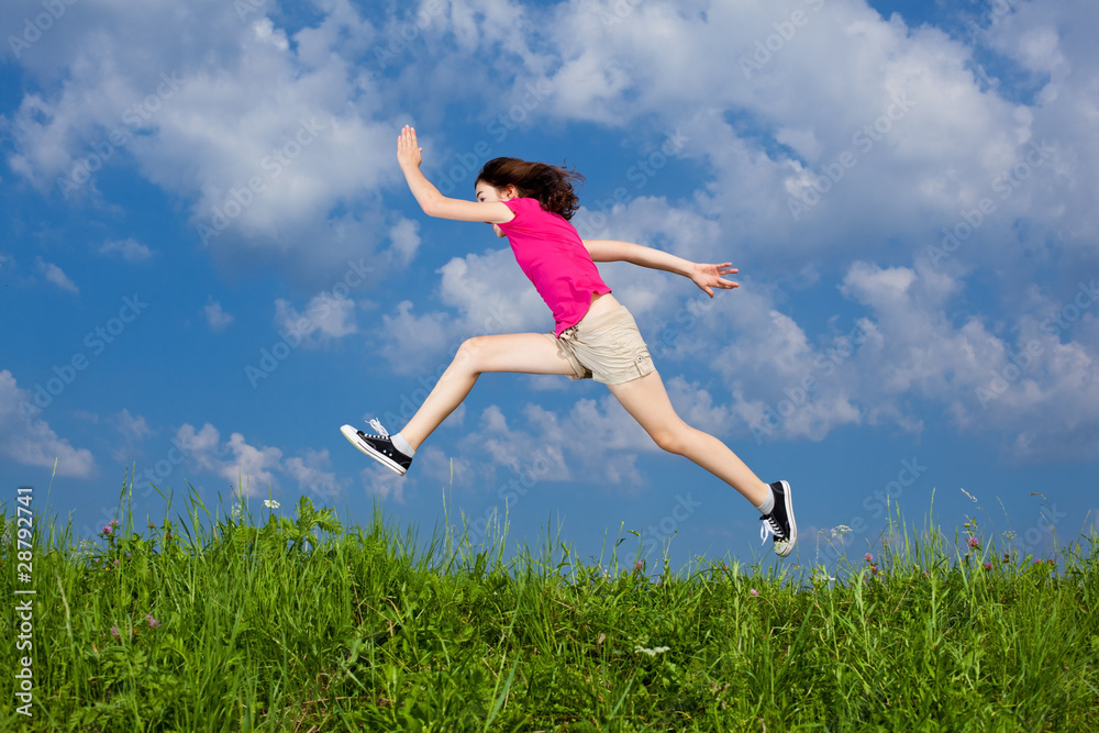 Girl jumping, running against blue sky Girl jumping, running against blue sky