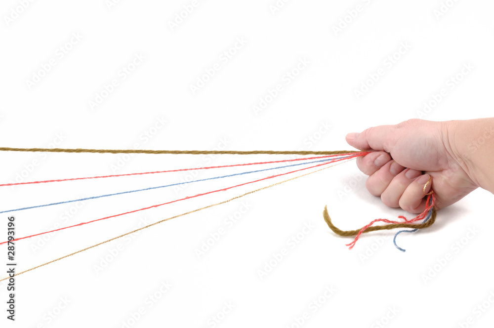 Fäden in der Hand StockFoto Adobe Stock