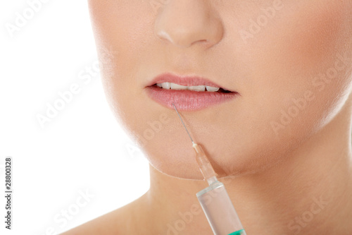 Young woman with syringe photo