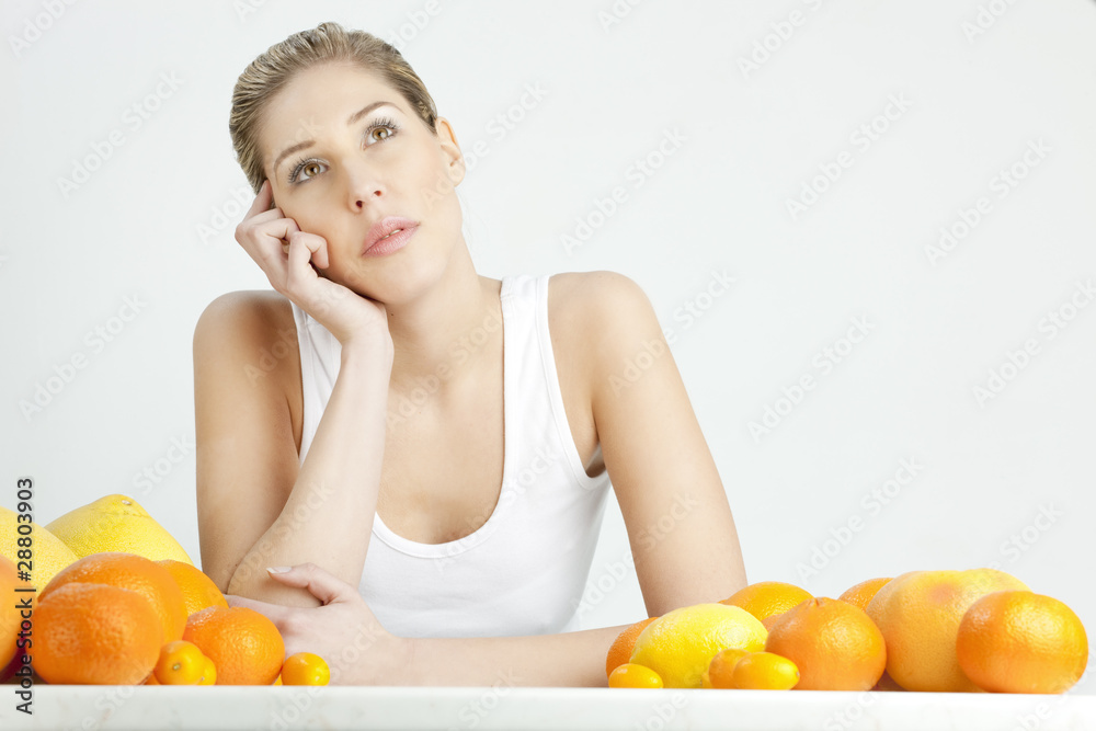 portrait of young woman with citrus fruit portrait of young woman with citrus fruit