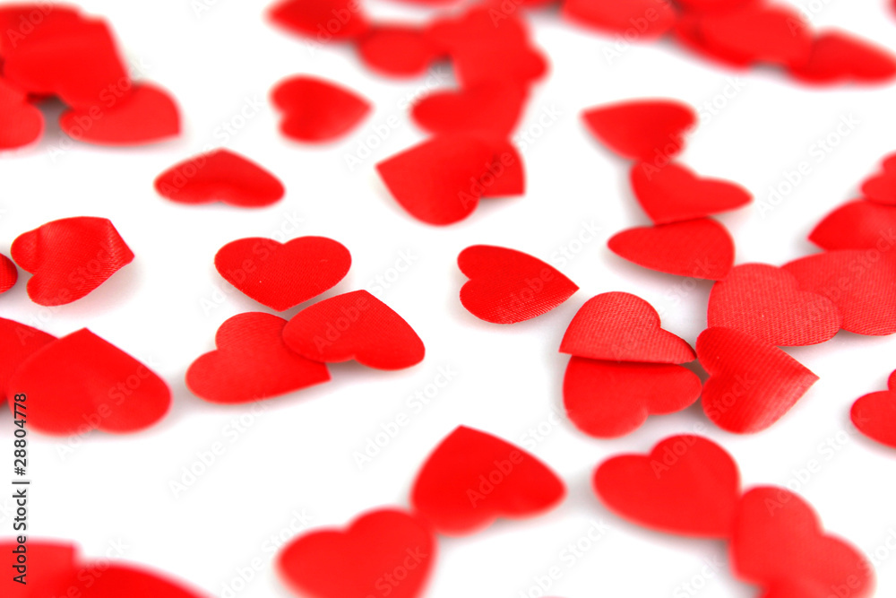 Red hearts confetti on white background Red hearts confetti on white background