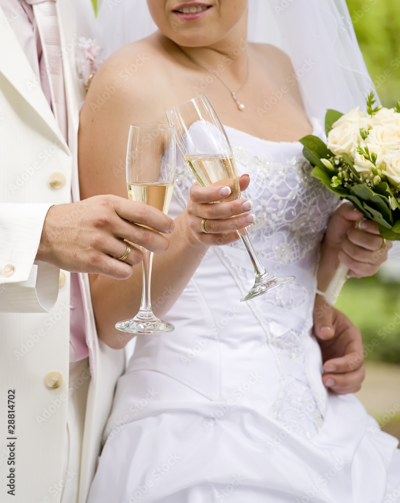 Bride and fiance clink glasses with glasses Bride and fiance clink glasses with glasses